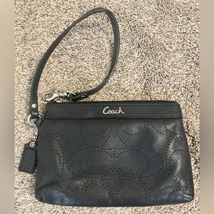 Small black coach wristlet, in good condition